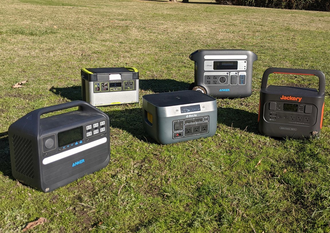 5 power stations on a grassy field in the sun