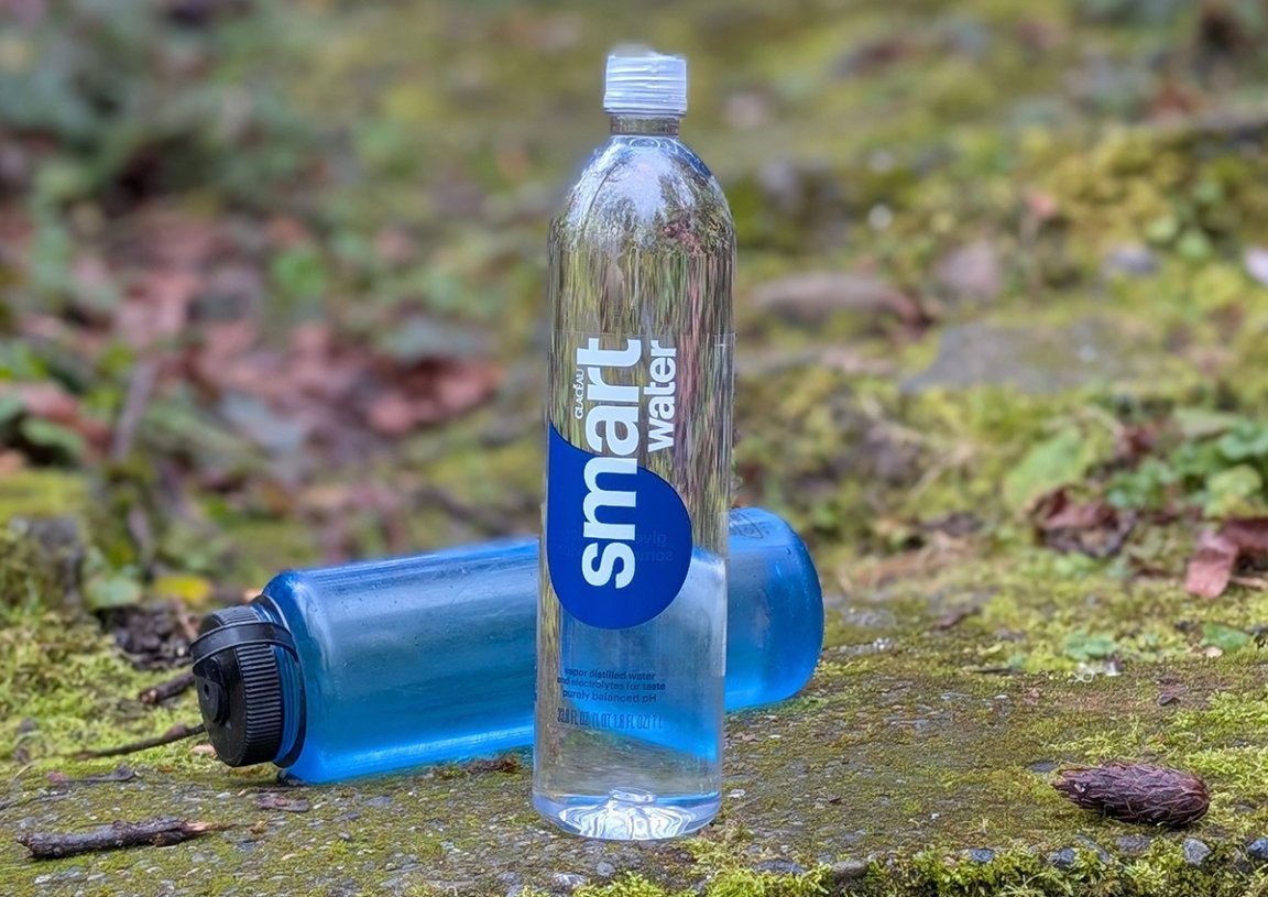 smartwater bottle standing proud with a fallen nalgene in the background