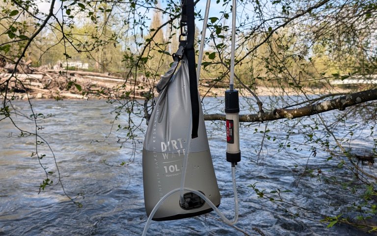 MSR Guardian Gravity dirty water bag with a river in the background