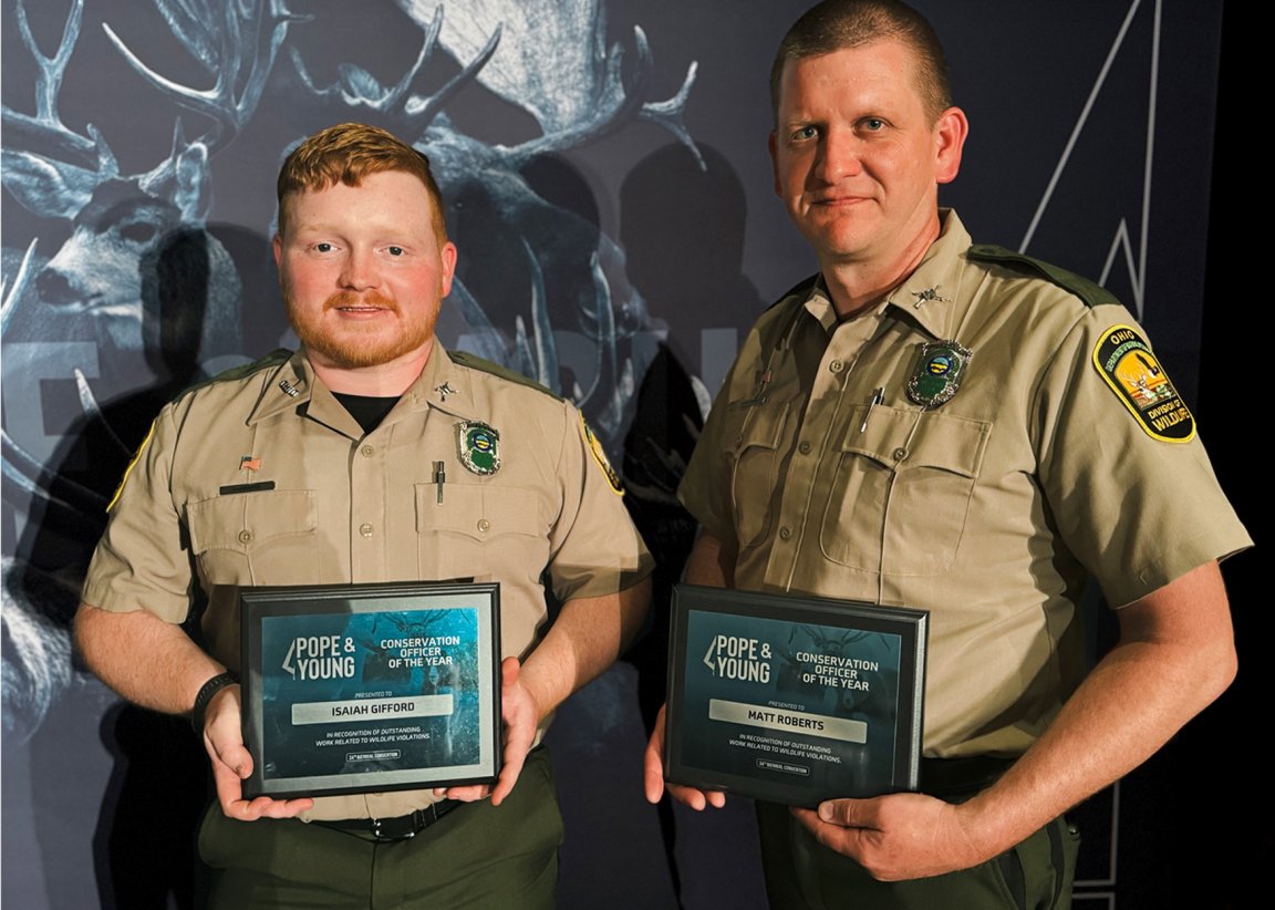 Two Ohio game wardens with the award they received from the Pope and Young Club in April.