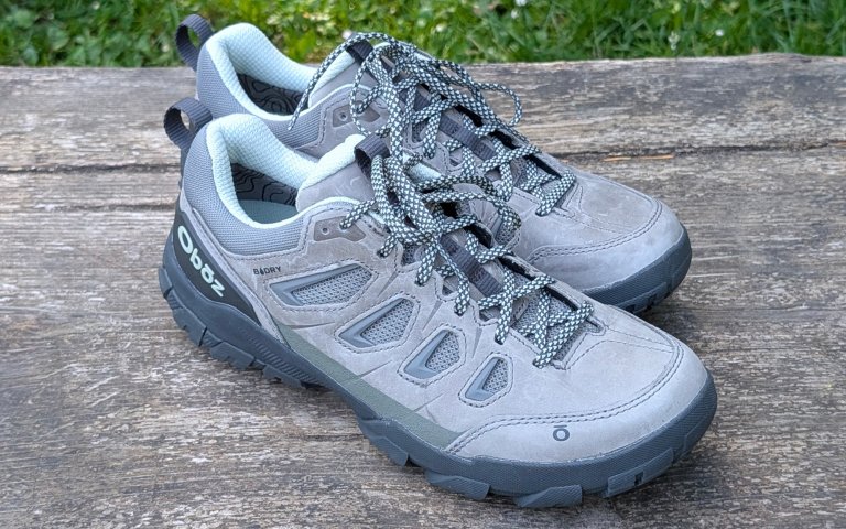 Oboz Sawtooth sitting on a wooden bench