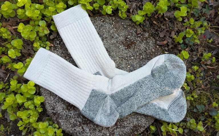 Smartwool Classic socks sitting on a round stone
