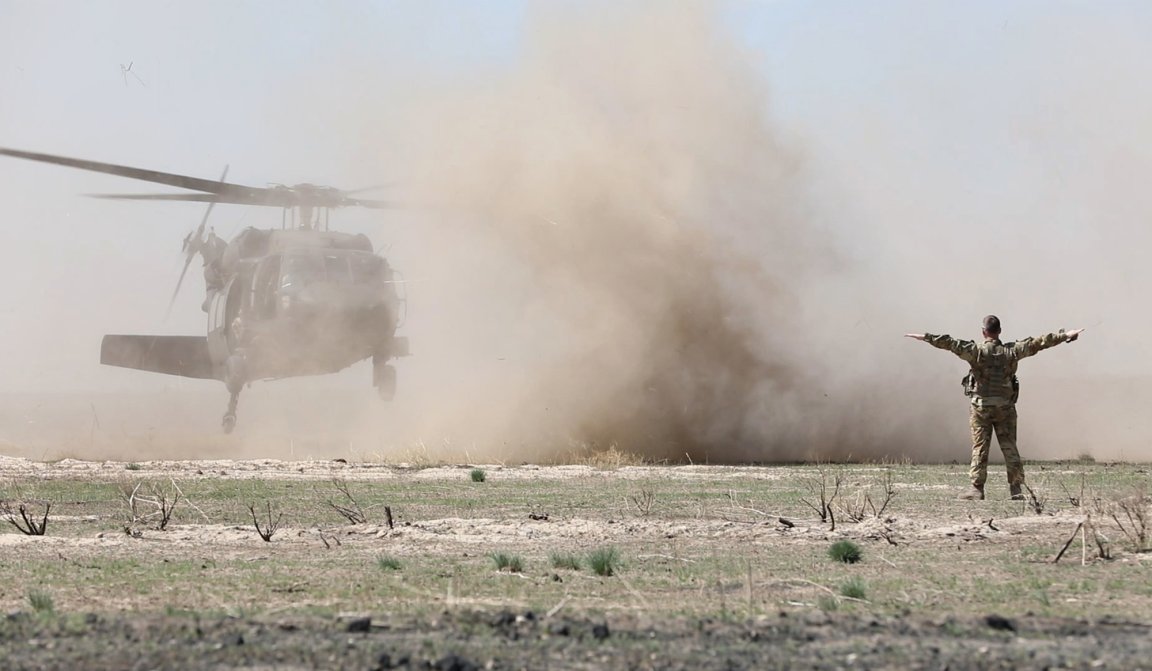 Montana national guardsmen land a helicopter.