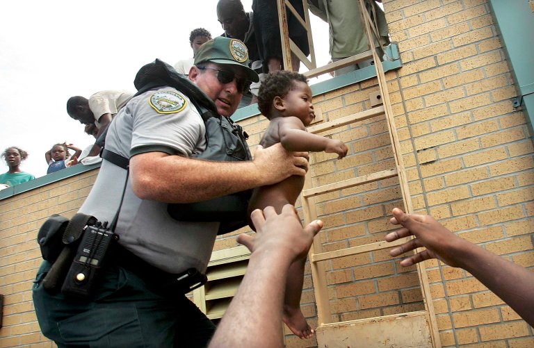 A LDWF game warden rescues a child from a rooftop.