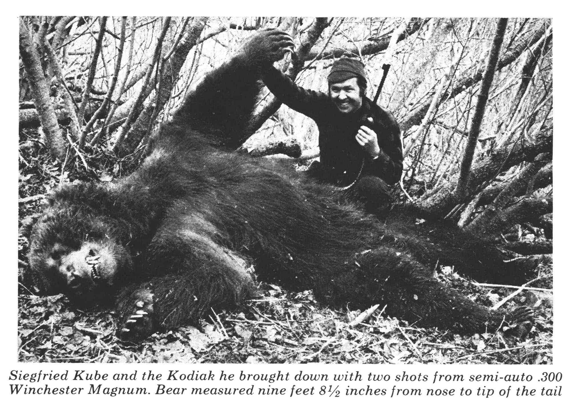 An old photograph of a hunter with a nice brown bear taken on Kodiak Island in Alaska.