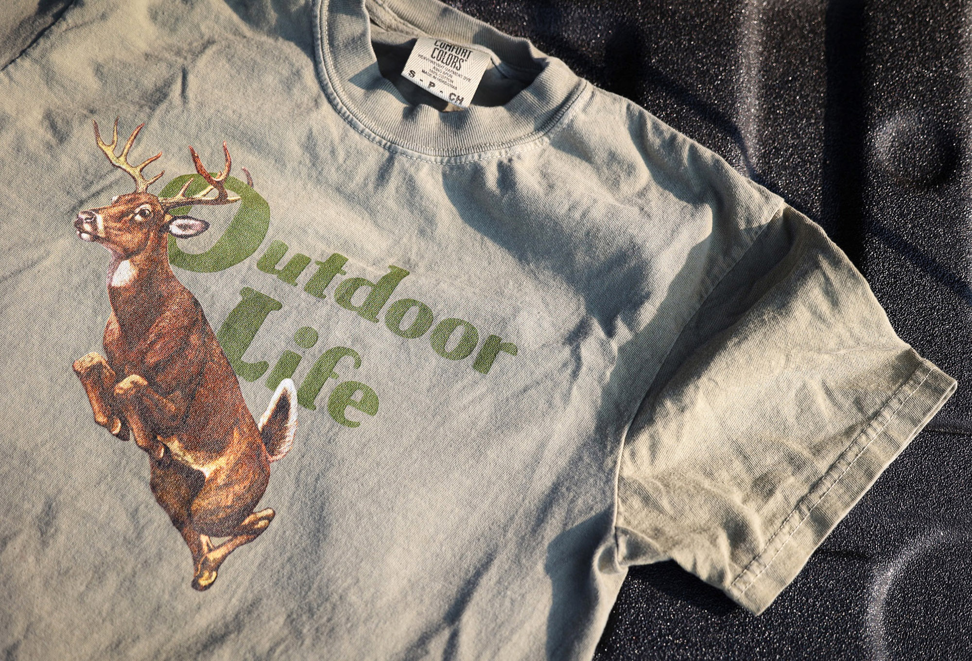 An Outdoor Life t-shirt of a big buck on a vintage logo