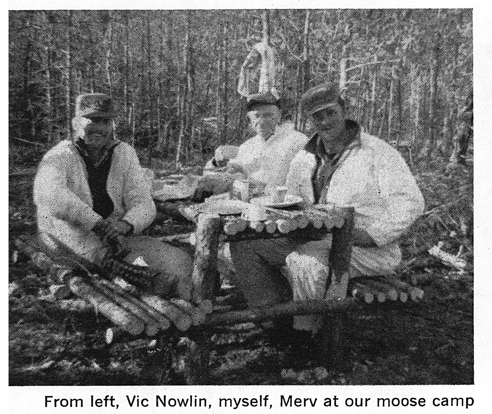 A black and white photo of hunters at moose camp.