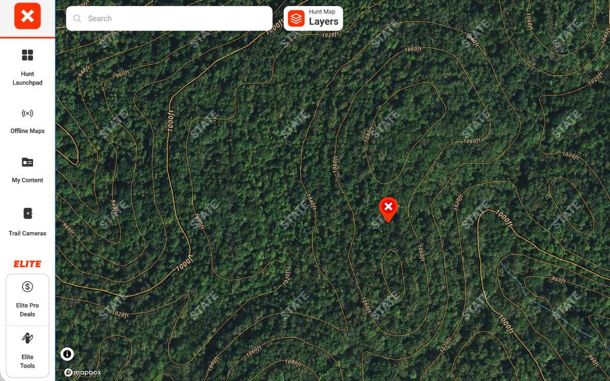 An example map showing the onX web platform and a waypoint on a terrain feature.