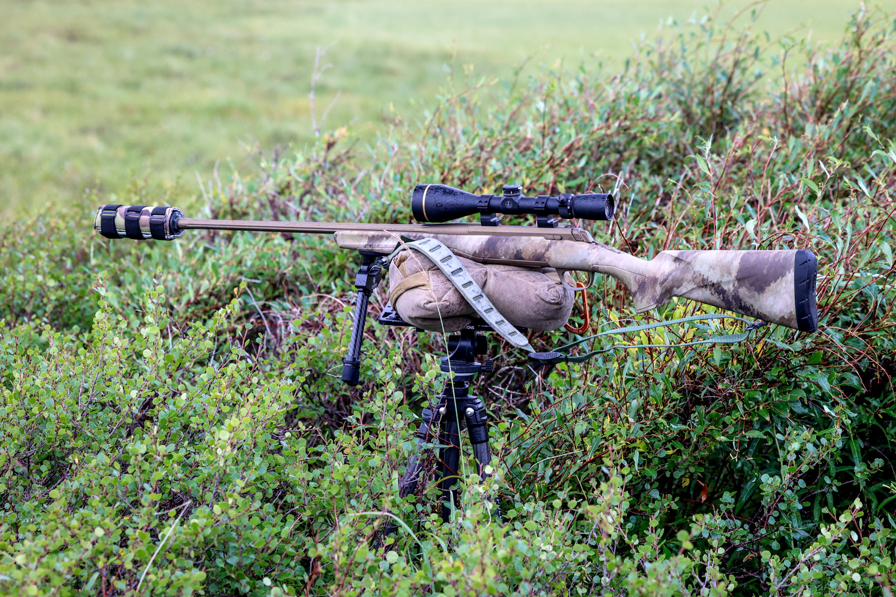 A rifle on a shooting bag.