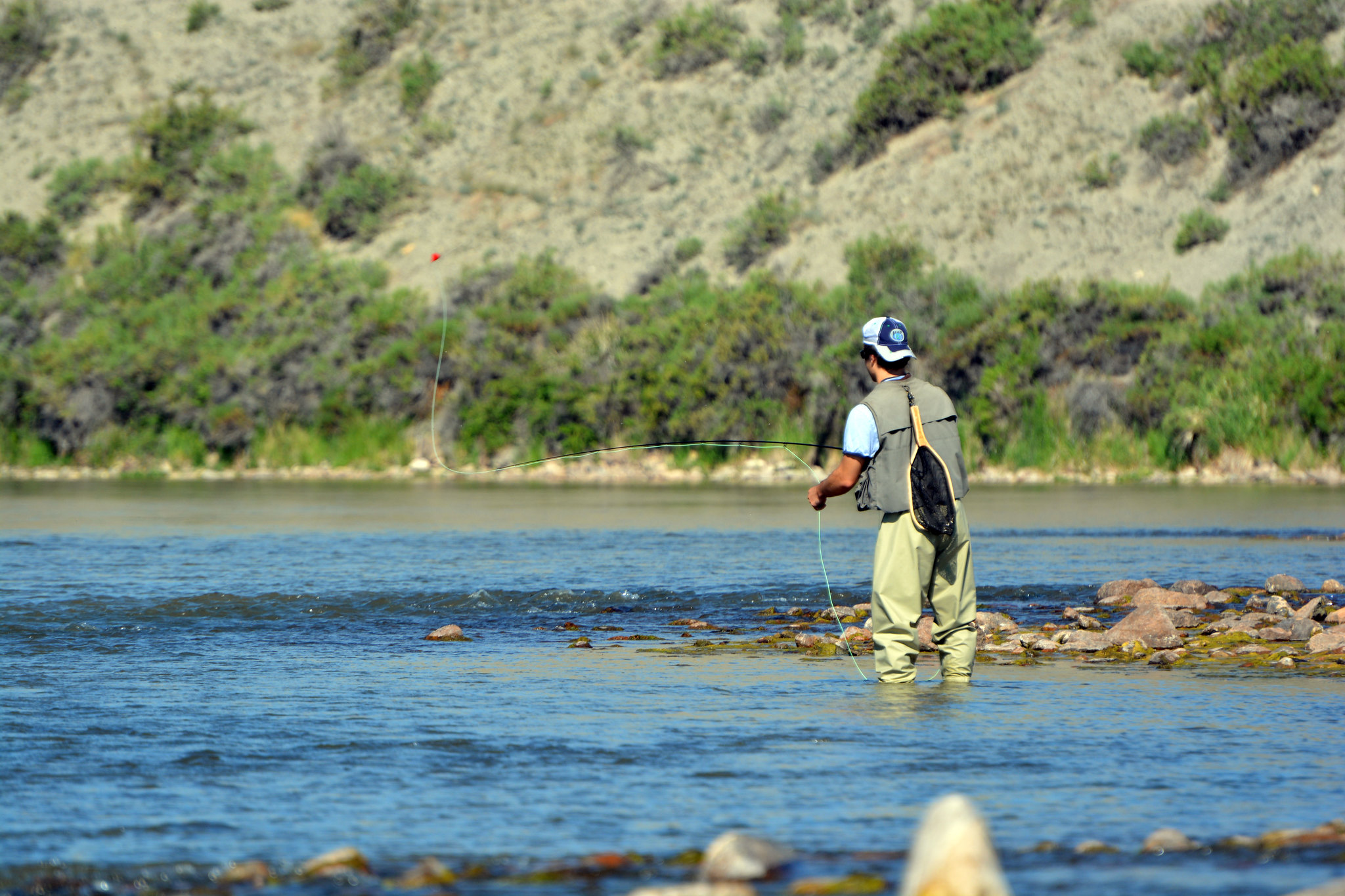 A fisherman throws a fly on the North Platte