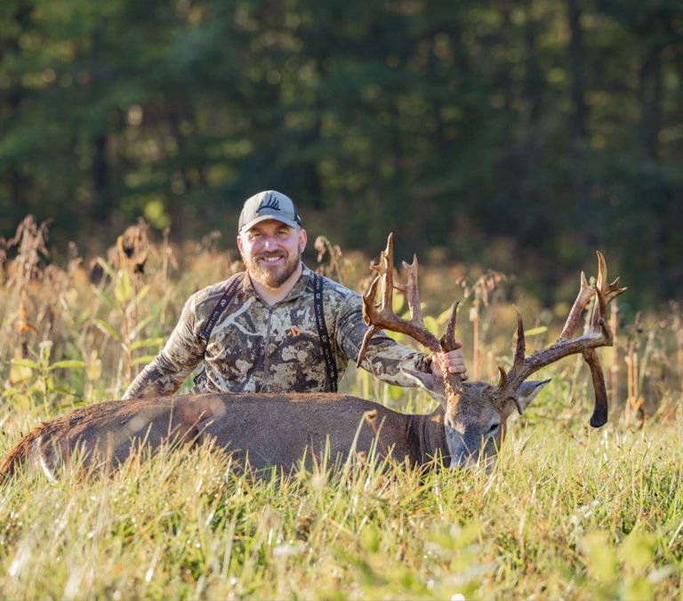 A hunter with a big droptine buck taken in Ohio.