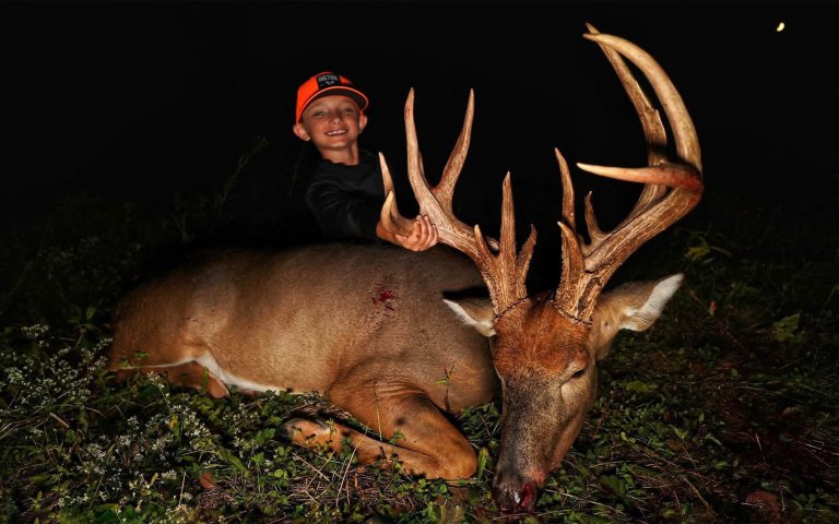 A young hunter with a huge Indiana buck tagged on opening day.