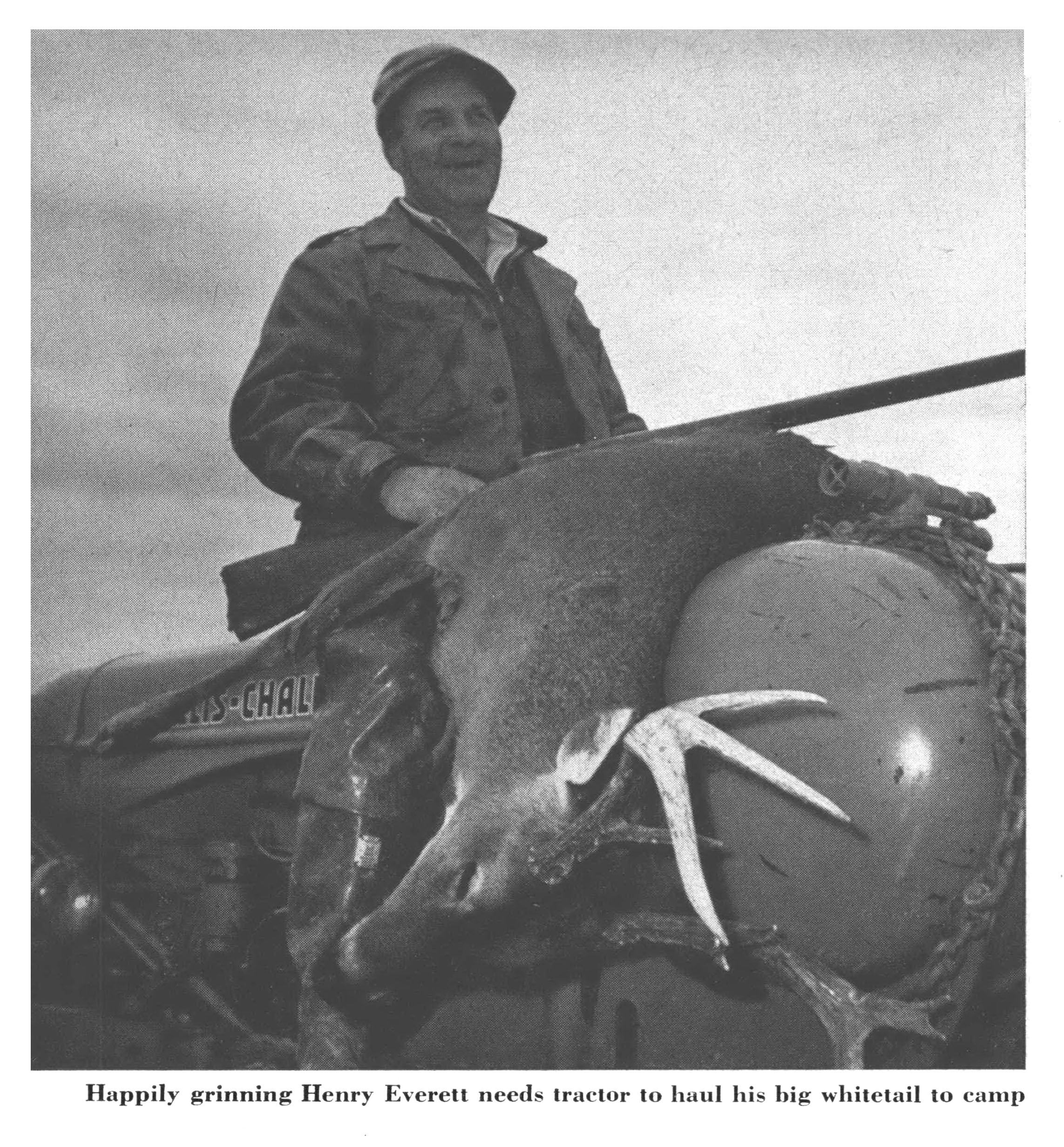 An old black and white photo of a buck and a hunter.