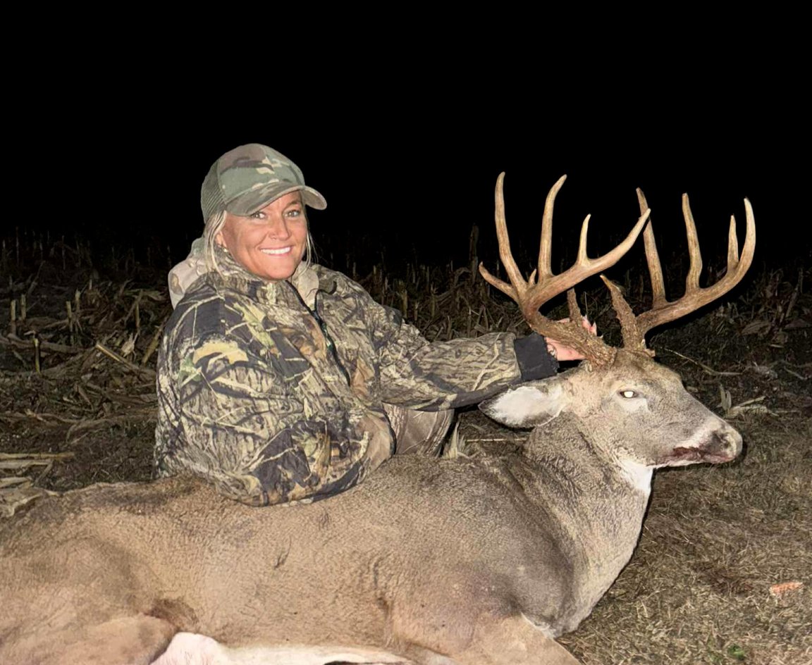 A deer hunter with a big buck from Indiana.