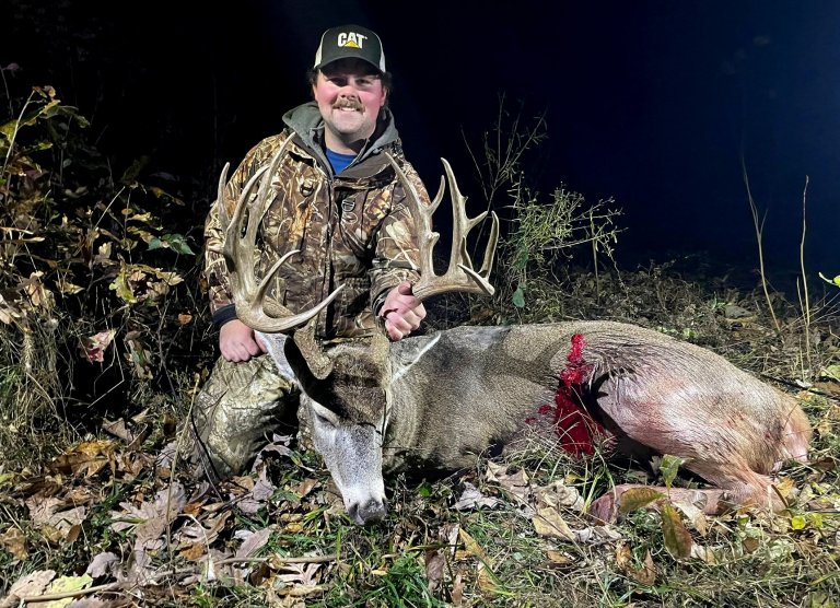 A bowhunter with a Missouri buck.