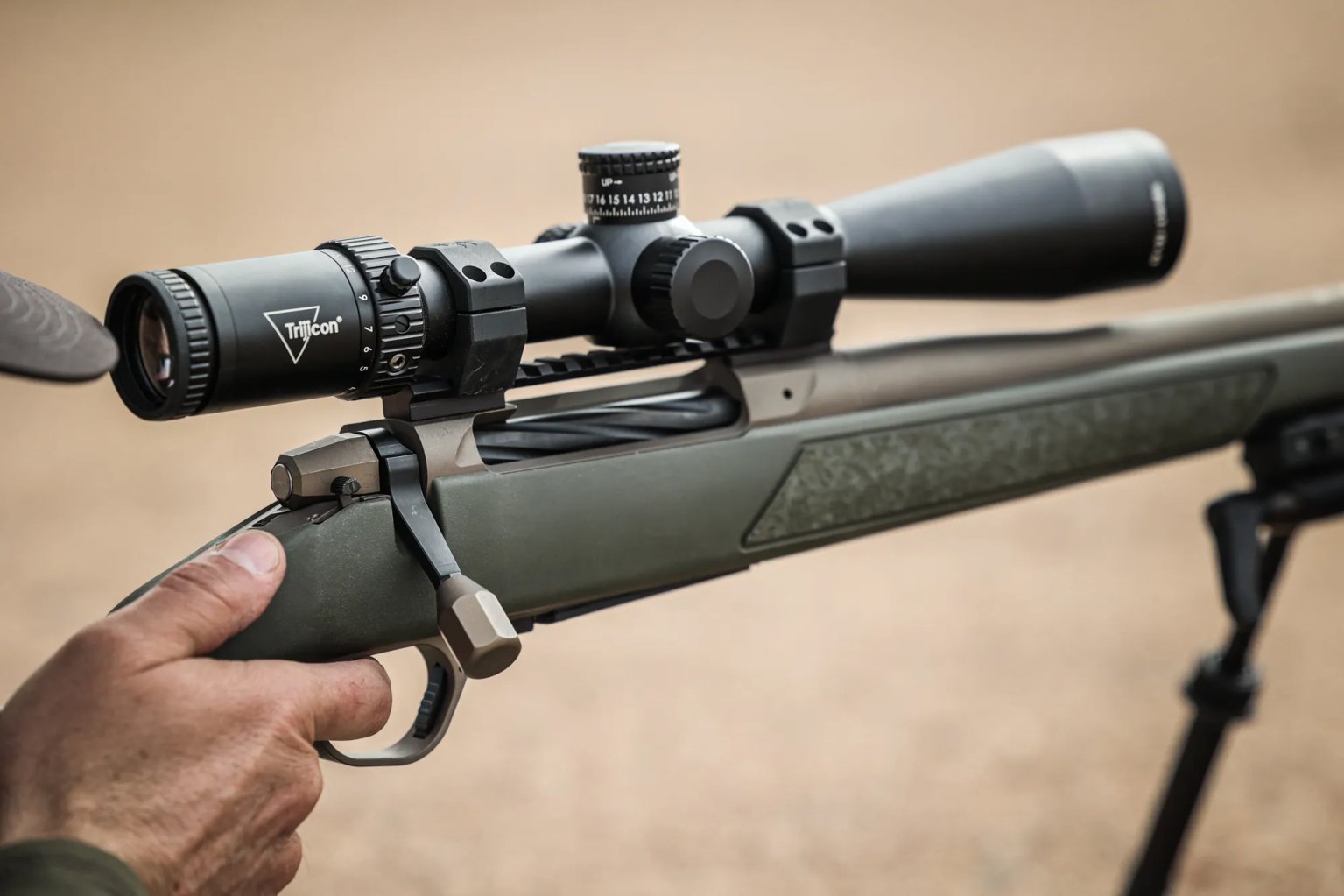 A hand on a rifle