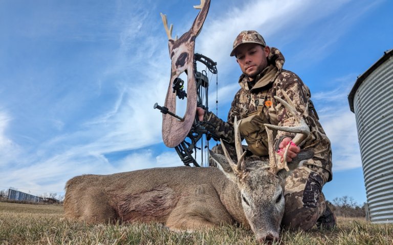 The author with a nice whitetail deer reaped with his bow and decoy.