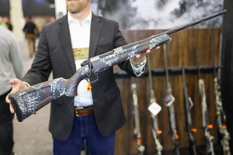 A man holding the Weatherby Mark V Capra.