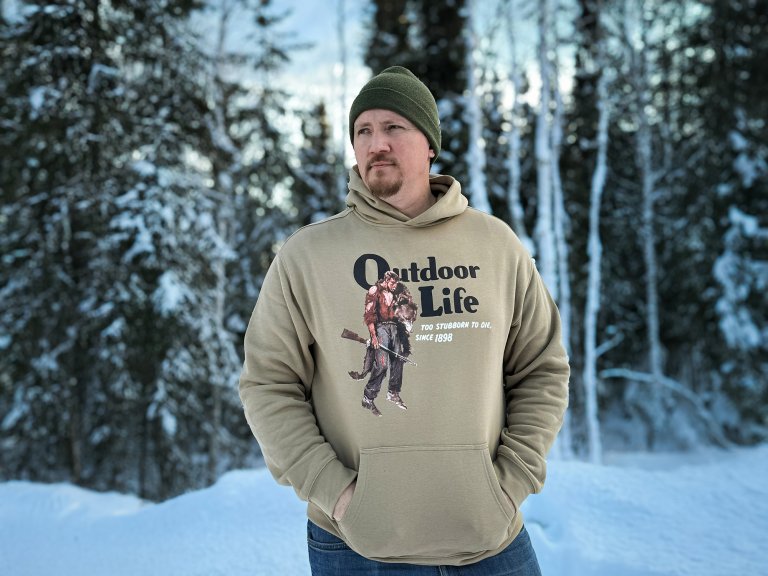 Senior staff writer Tyler Freel wears an Outdoor Life revenant hoodie.