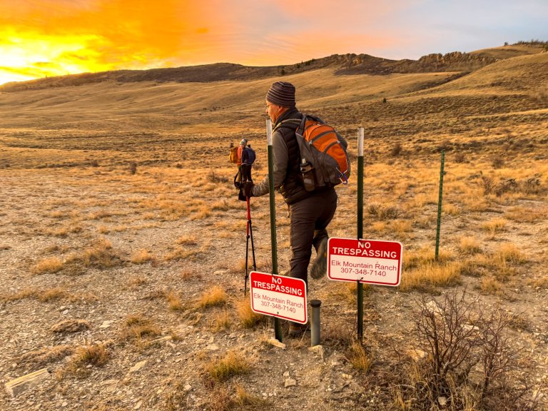 A hiker crosses at Iron Bar ranch