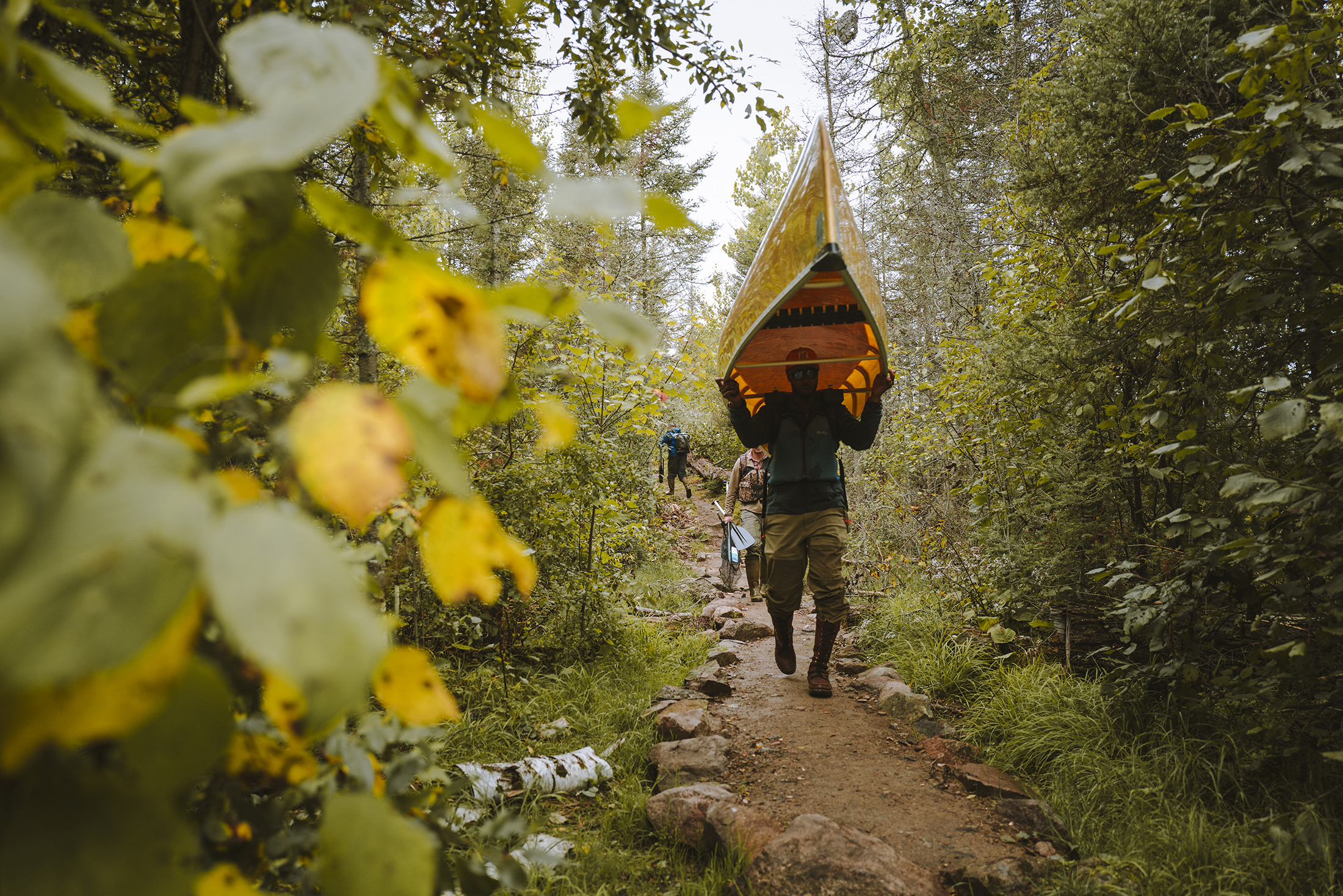 A paddler portages a canoe in the Boundary Waters.