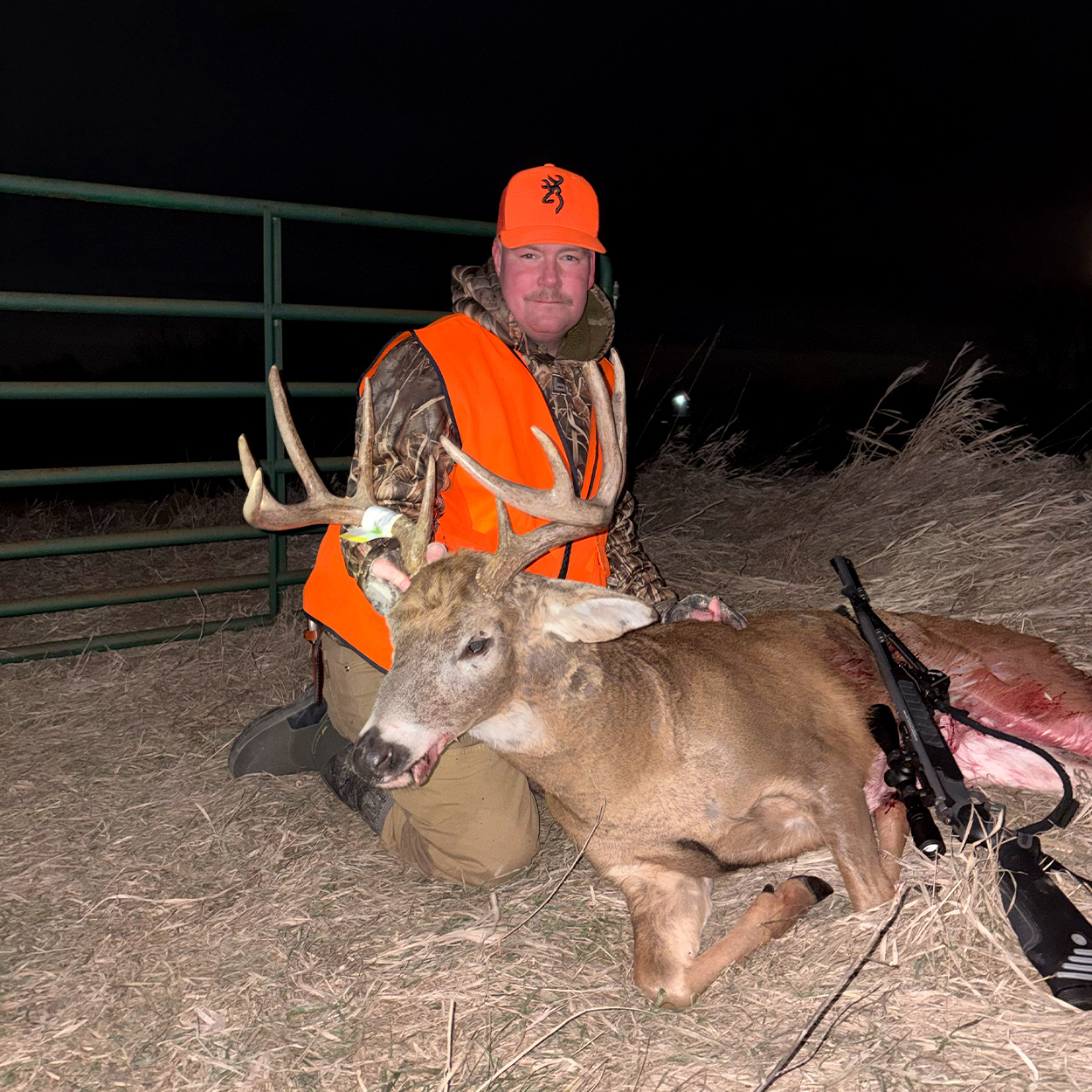 An Iowa hunter with a buck taken with a muzzleloader.