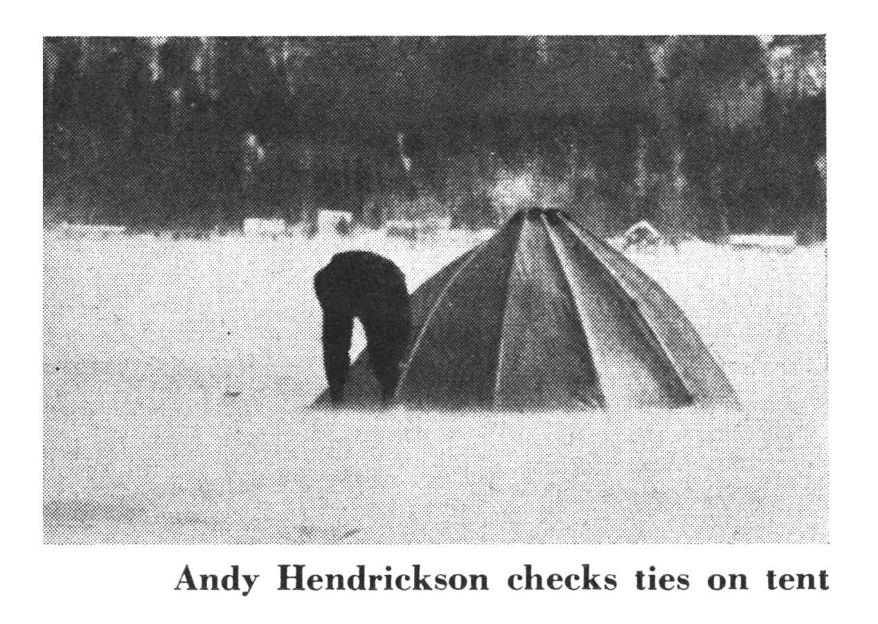 An old photo of an ice fishing shelter.