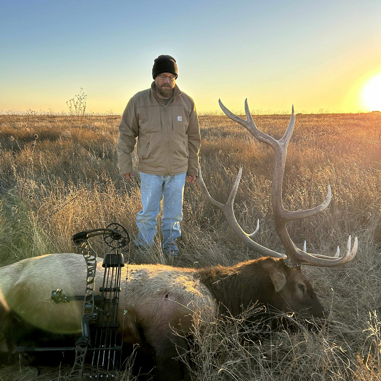 A bowhunter with a big elk taken in the Oklahoma panhandle.