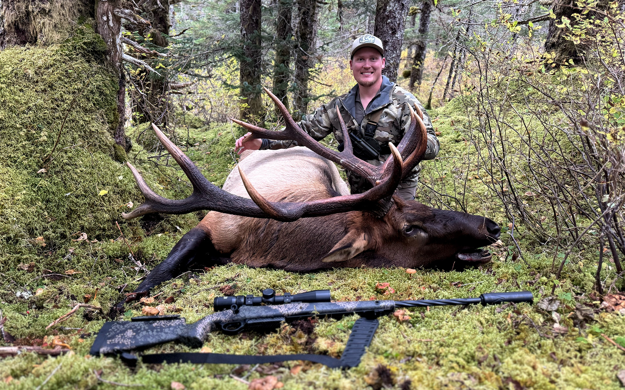 A hunter with a bull elk tagged on Alaska's Afognak Island.