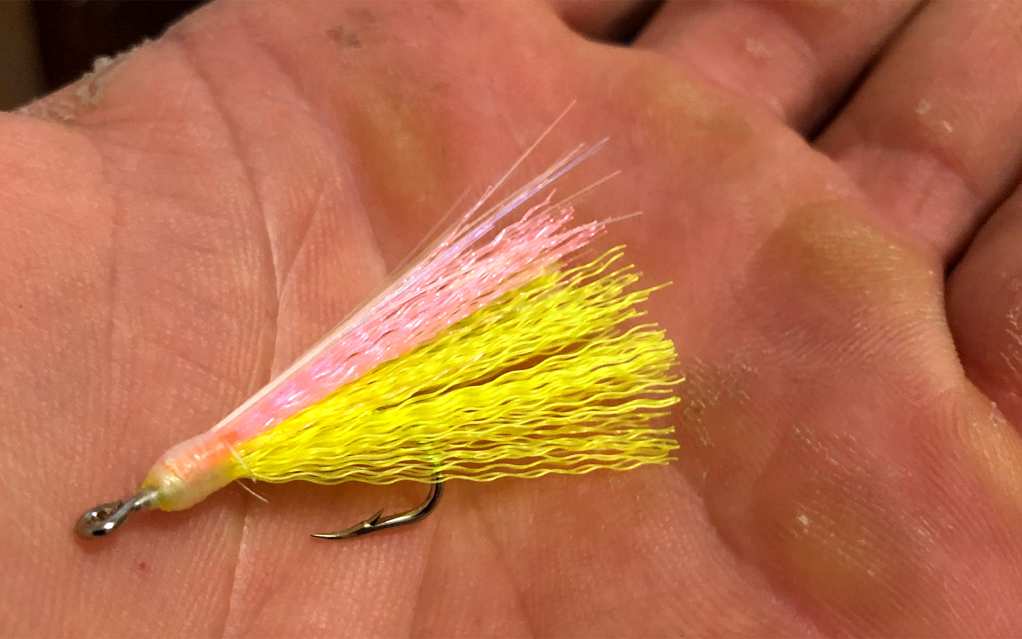A jig in an angler's palm.