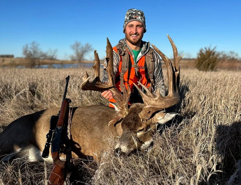 A hunter with a giant South Dakota buck.