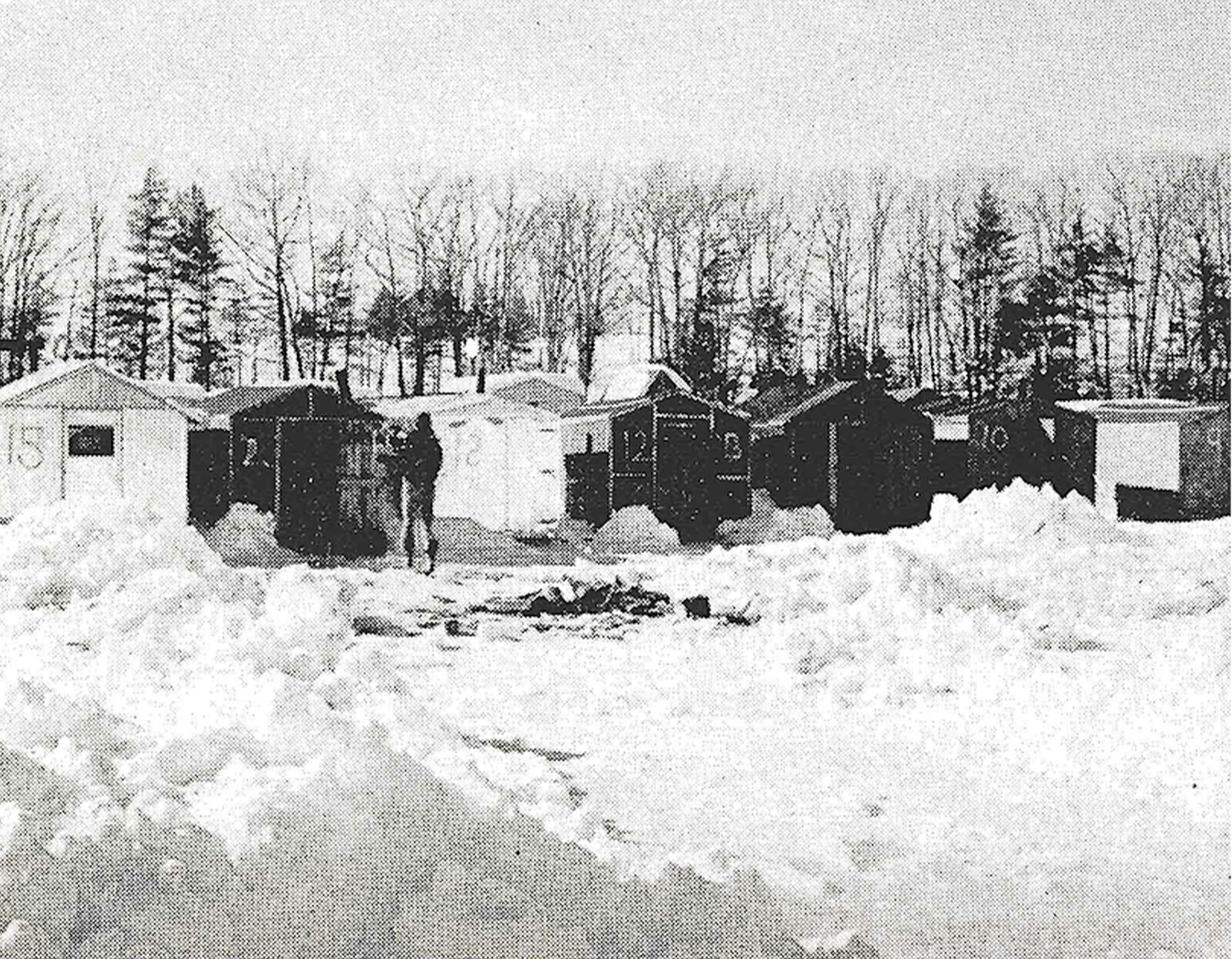 Some ice shanties on a frozen river in Maine.
