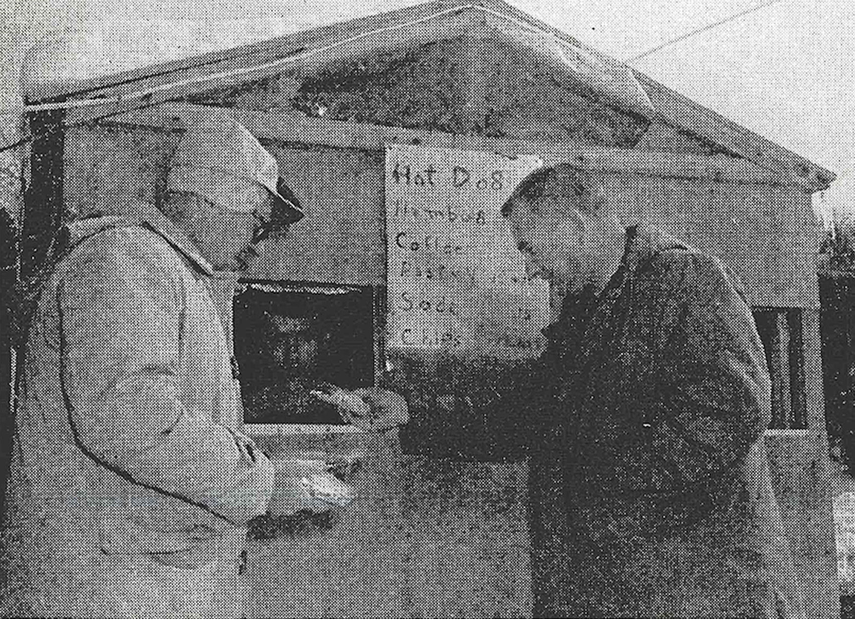 Fisherman buy snacks at a shack during ice-fishing season.