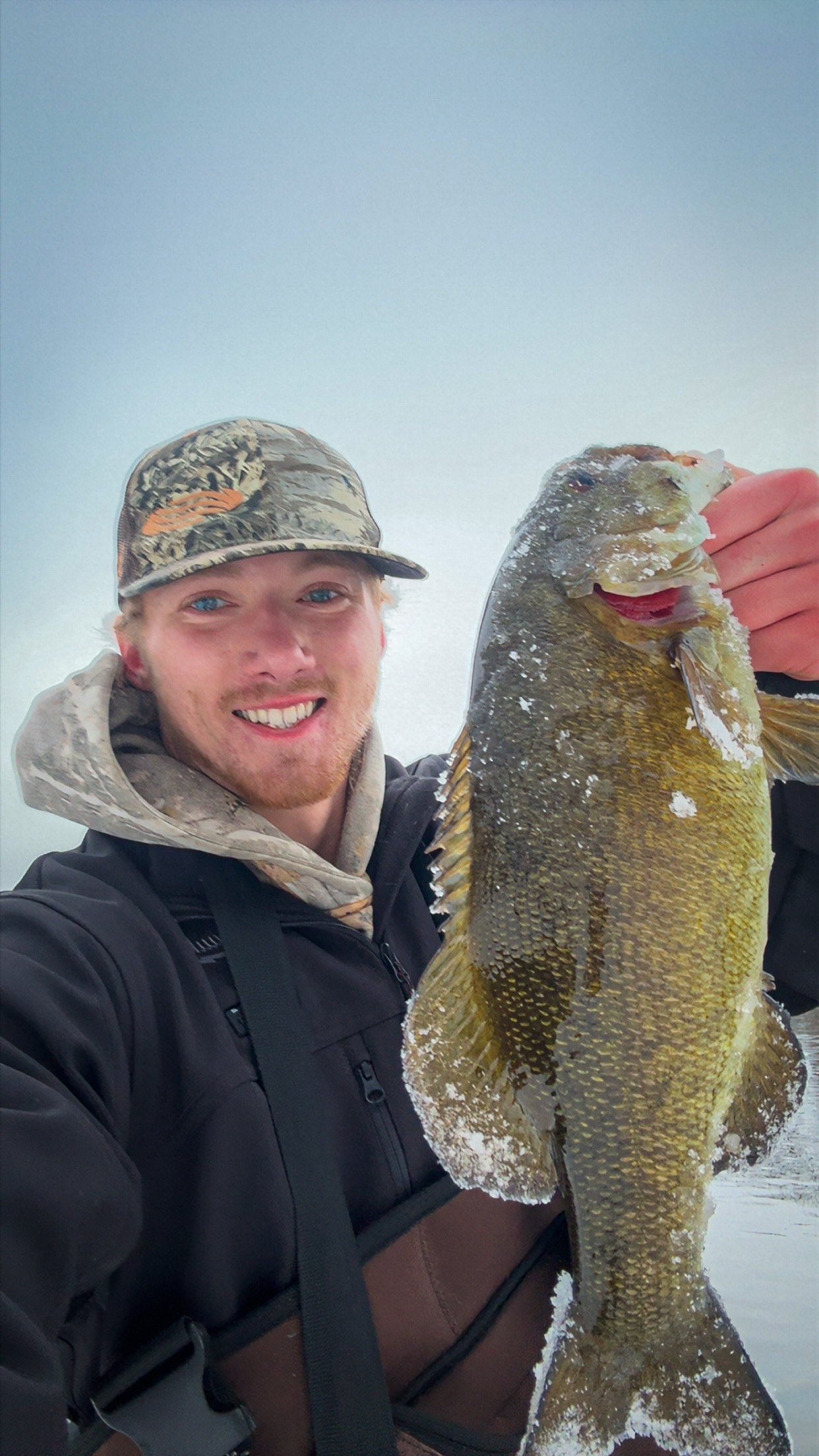 Jake Drahota with a nice smallmouth caught in the ice.