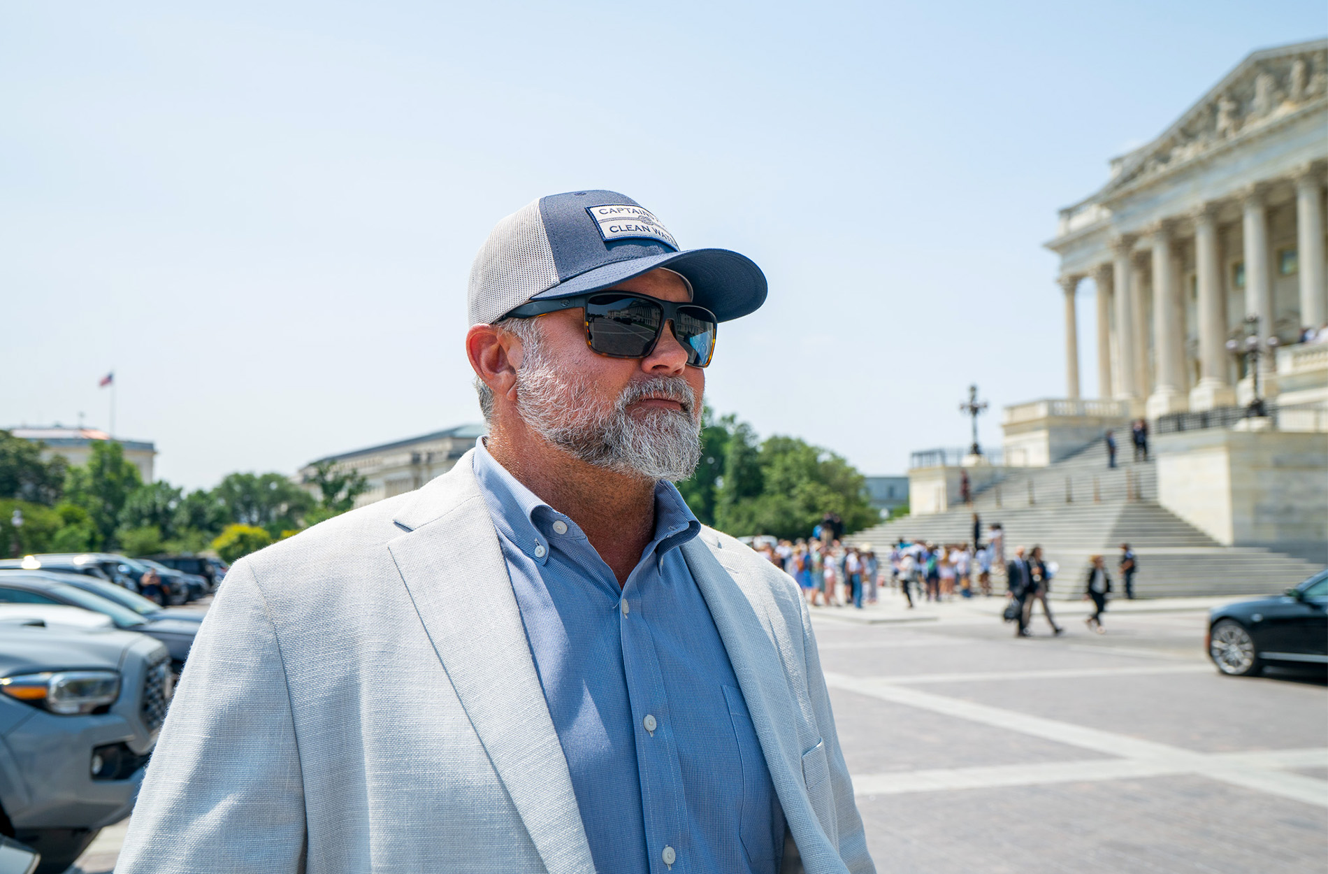 Captain Chris Wittman in front of a government building.