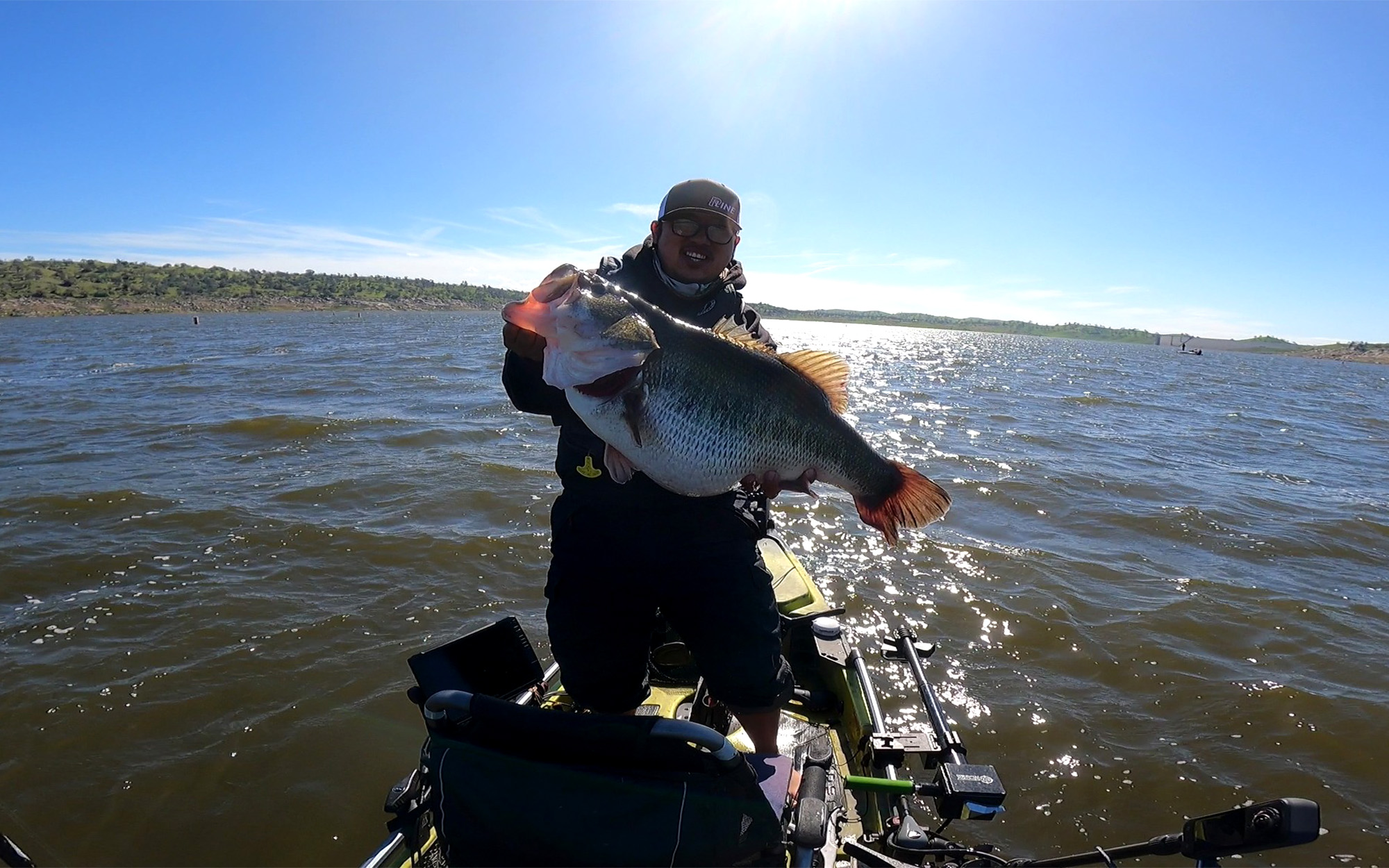 A California kayak angler with a giant largemouth bass.