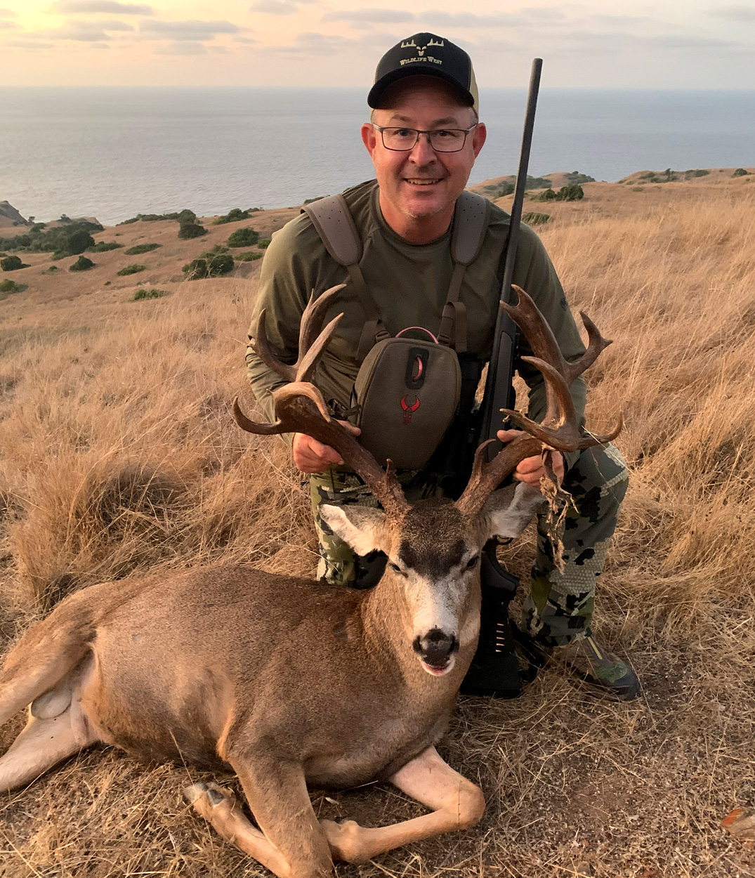 A hunter with a buck tagged on Catalina Island.