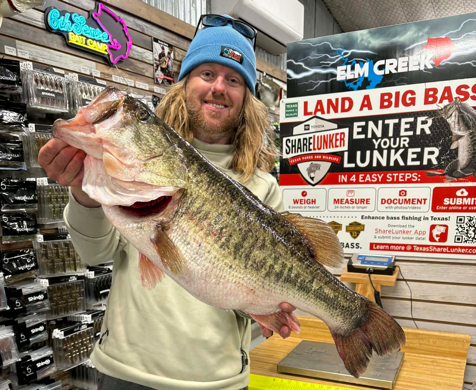 A bass angler with a huge largemouth.