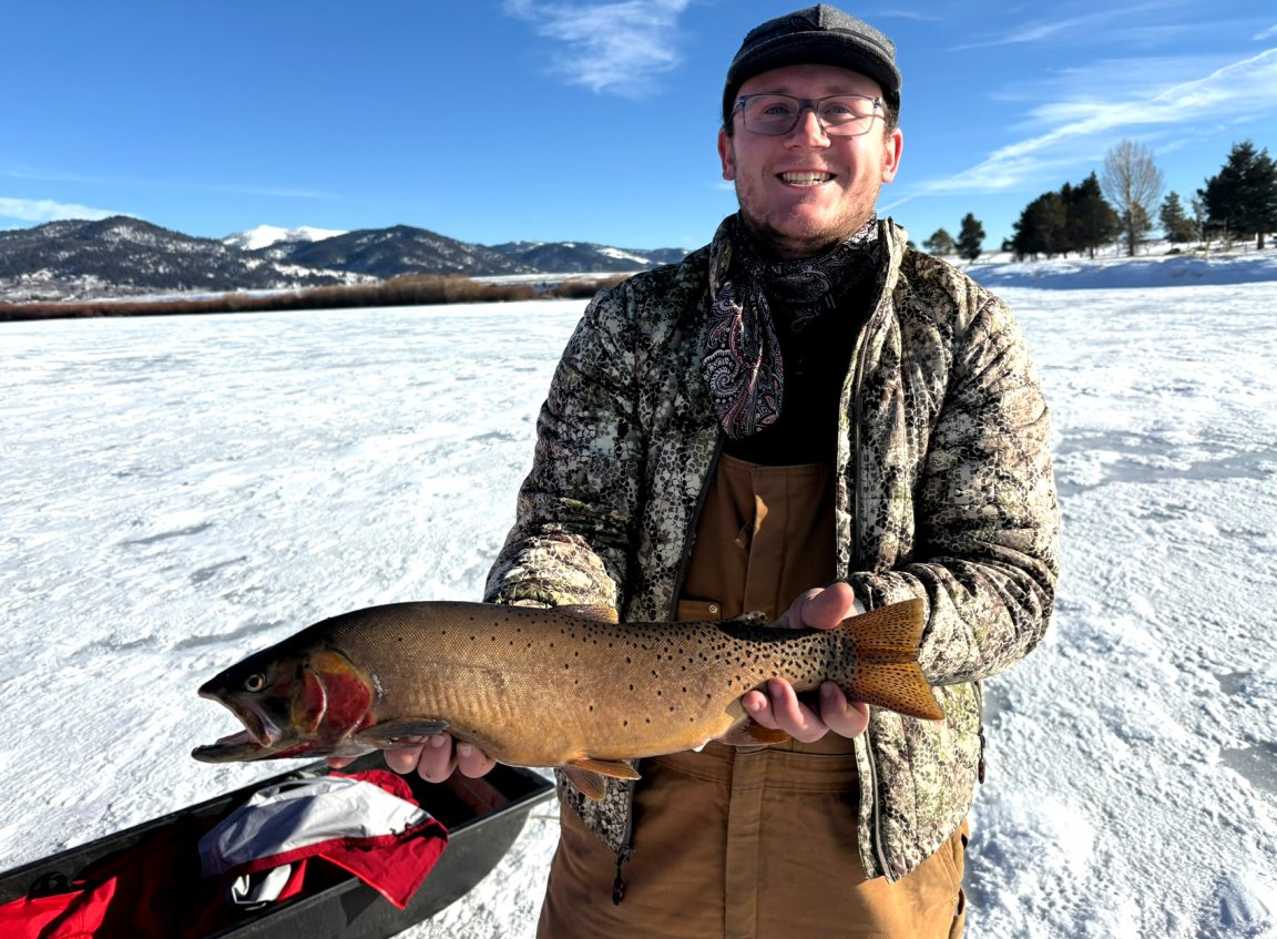 An Idaho angler with a big Yellowstone cutthroat trout.