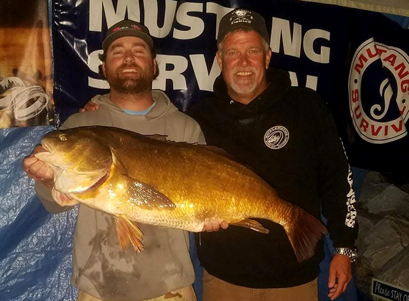 A Vermont angler holds up a state-record drum