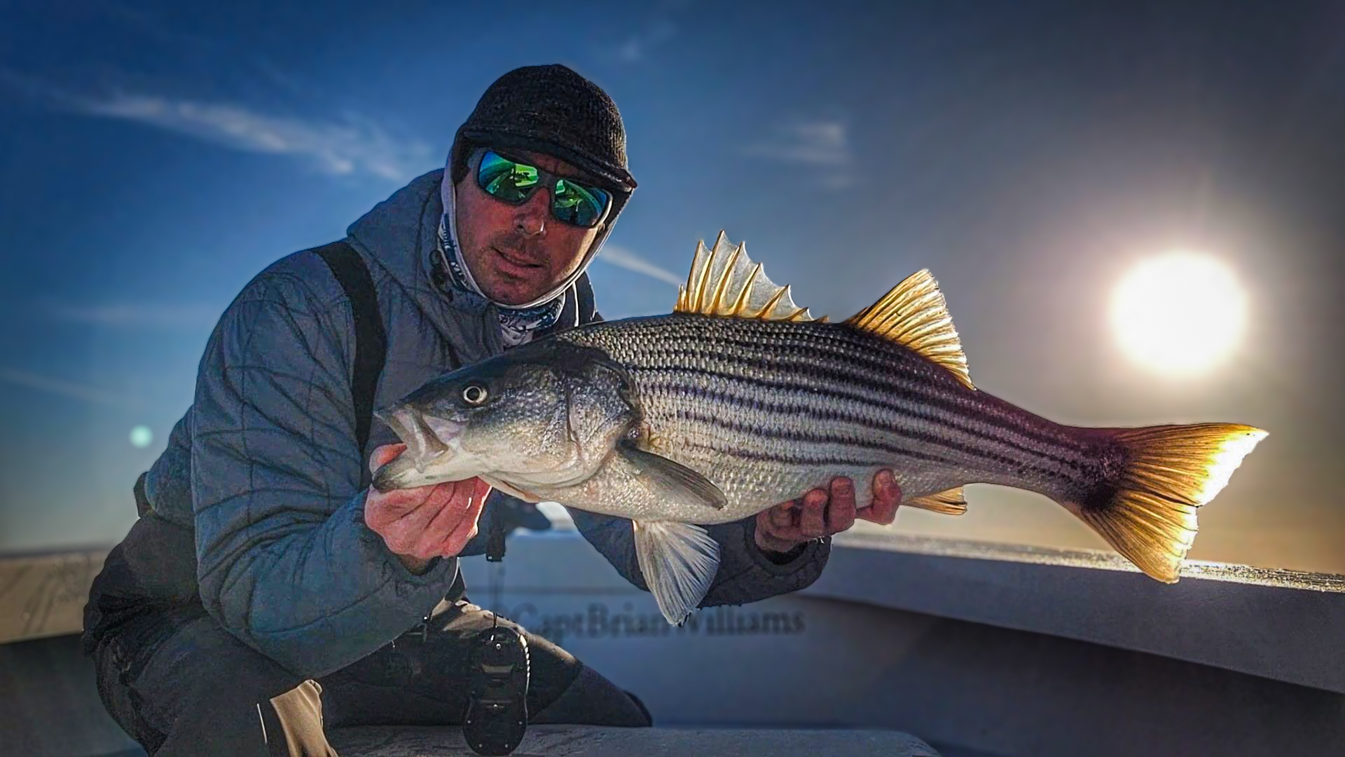 Captain Brian Williams holds up a nice March striper