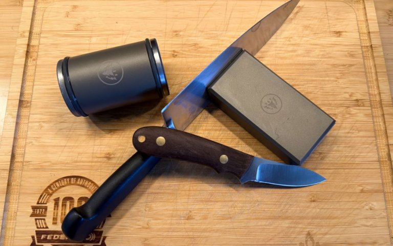 A knife and the HORL sharpener lay on a cutting board