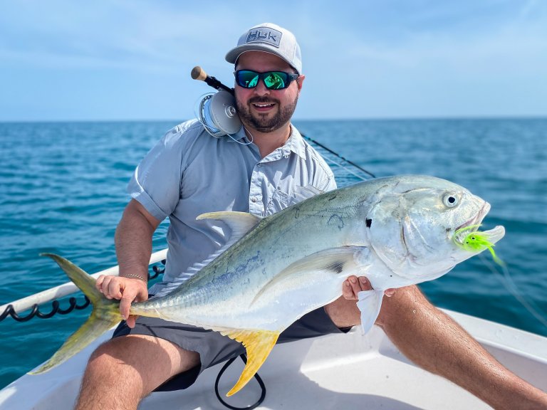 A fly angler with a Jack Crevalle caught ona. fly.