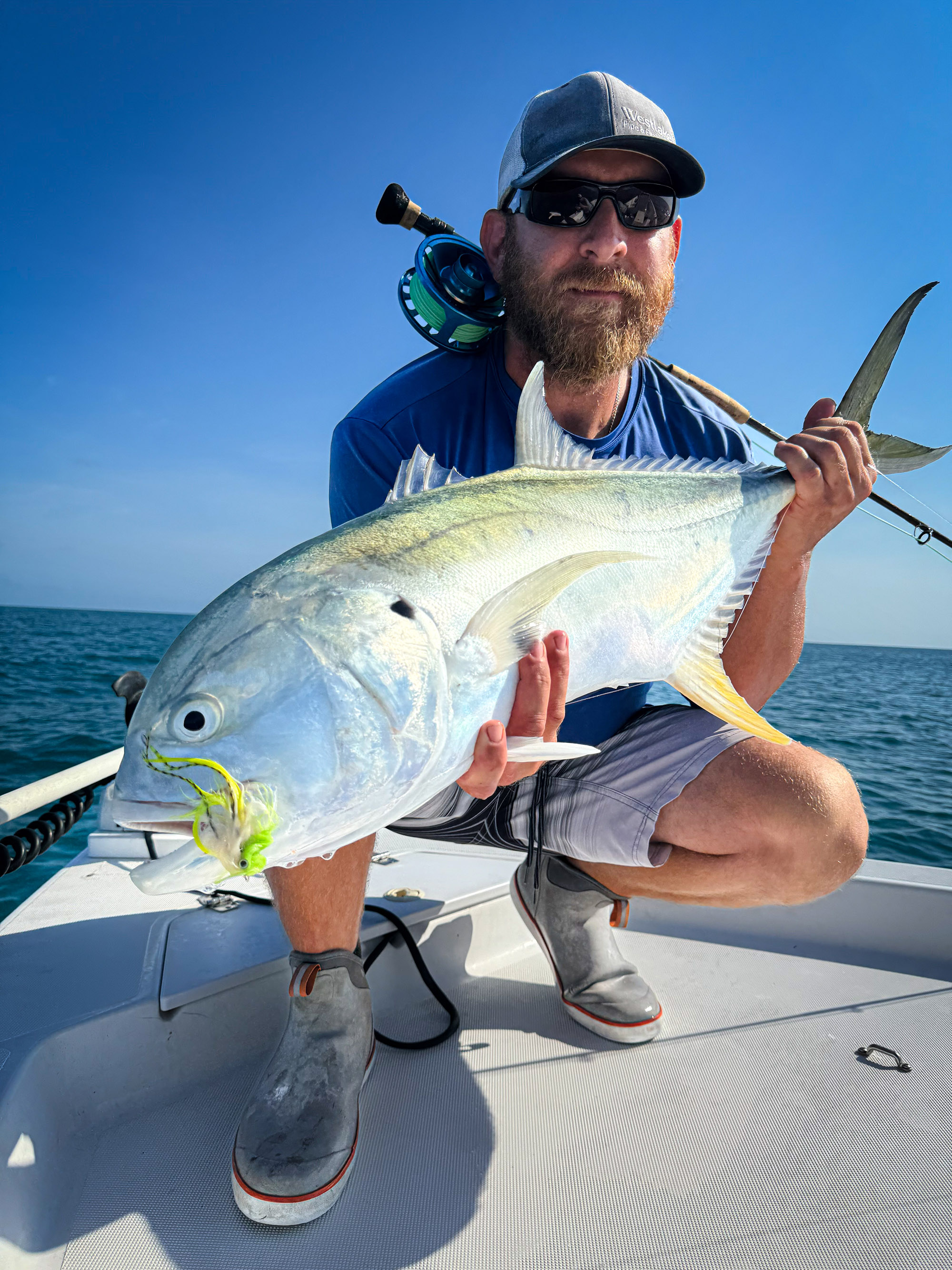 A fly angler with a crevalle.