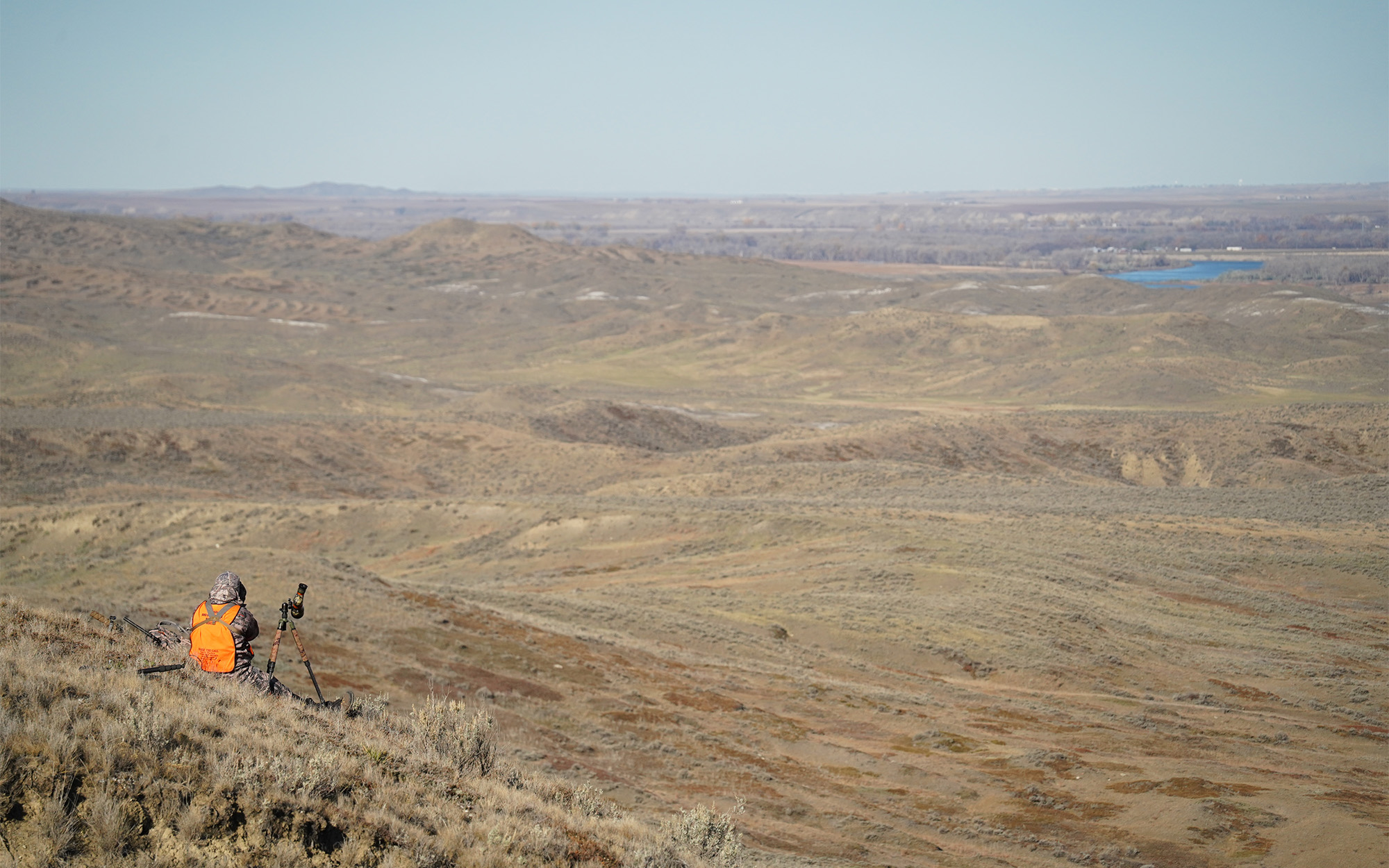 A hunter glasses for deer in Montana.