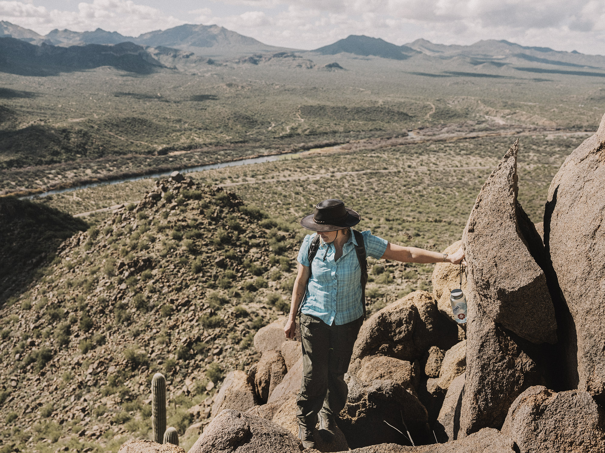 Jessie Krebs on boulders above the desert.