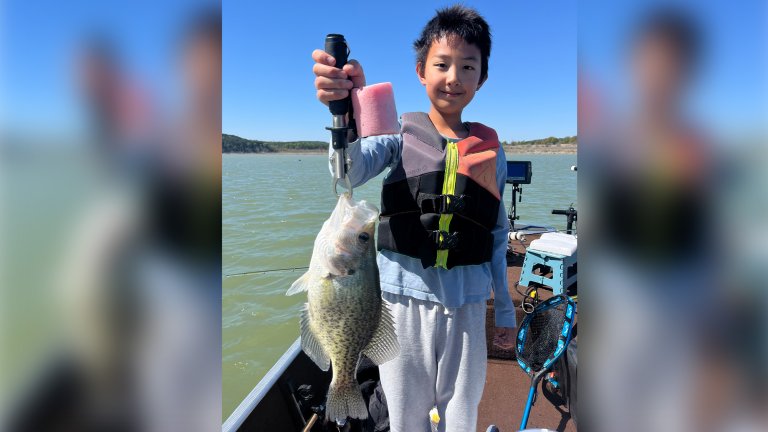 A young Texas angler with a pending record crappie.