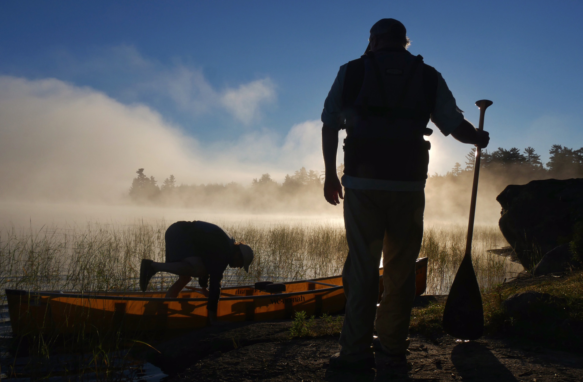 Two explorers travel by canoe in the Boundary Waters.