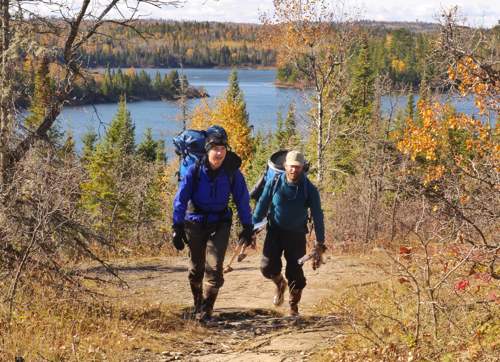 Two explorers on portage in the Boundary Waters.