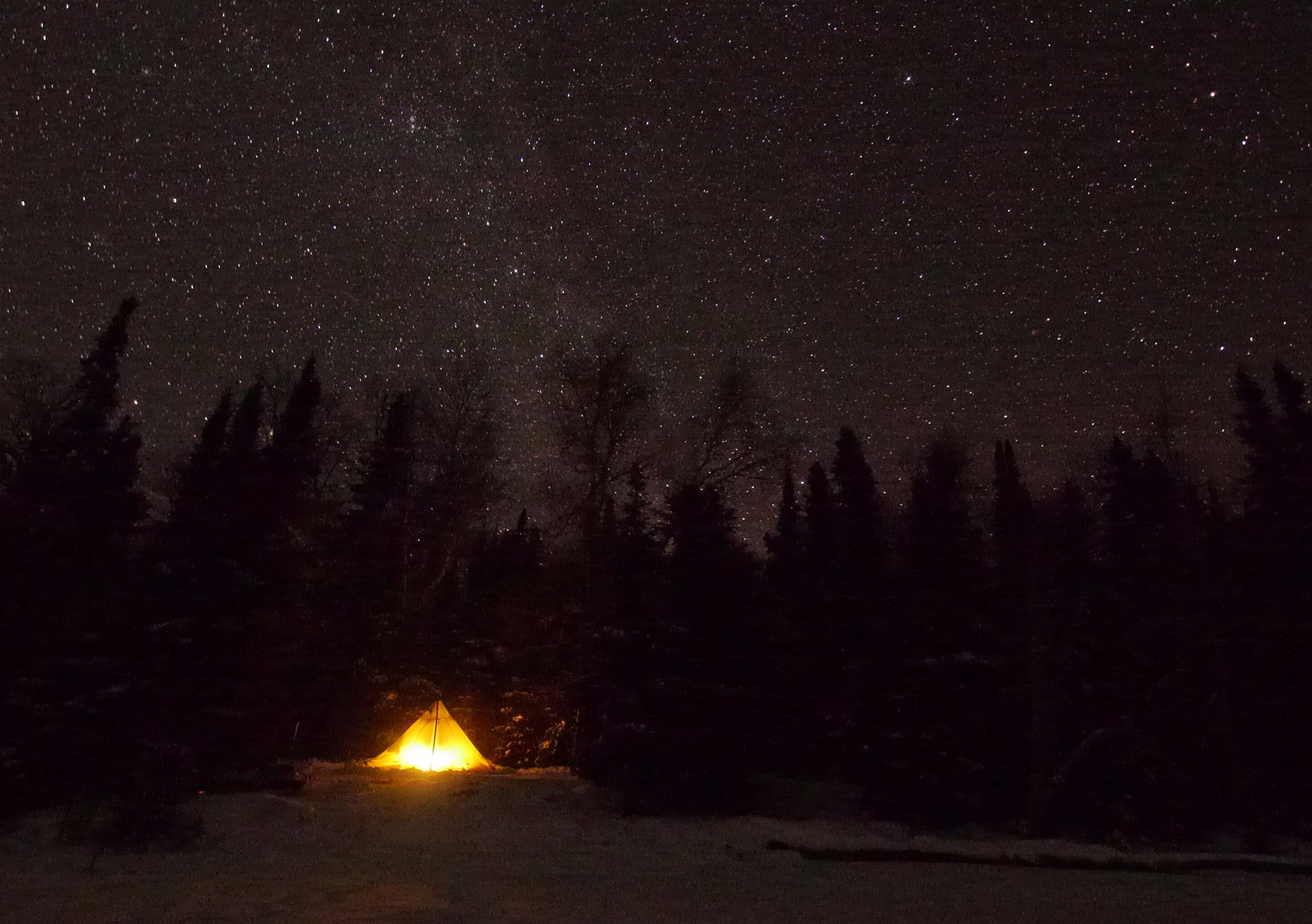 Camping under a starry sky in the Boundary Waters.